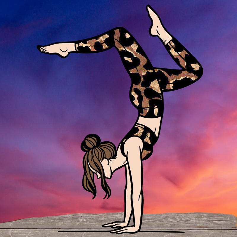 a woman doing a handstand