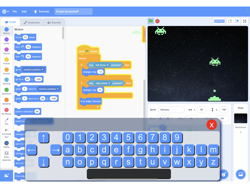 ScratchUP - ScratchUP iPad interface with block coding and custom virtual keyboard for a space game.