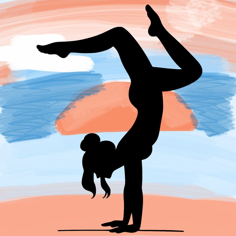 a woman doing a handstand