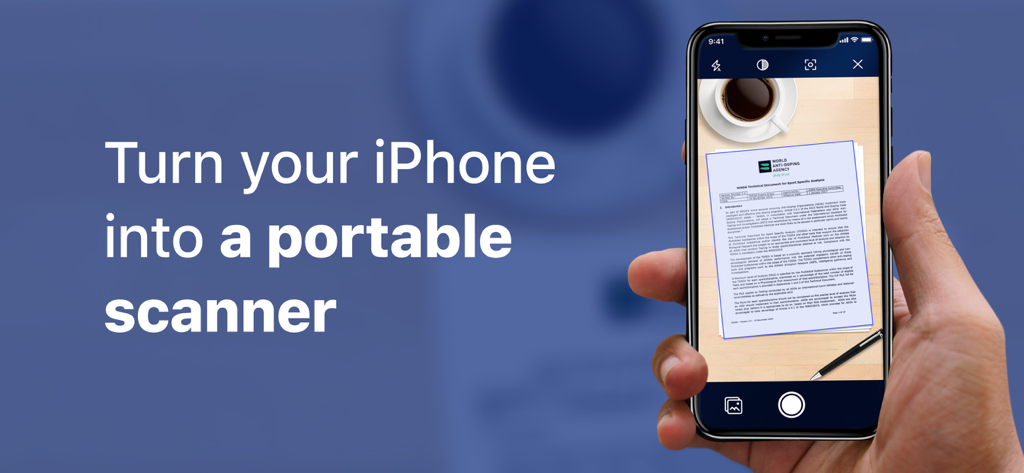 A hand holding an iPhone using the PDF Document Scanner app to scan a document on a table next to a coffee cup