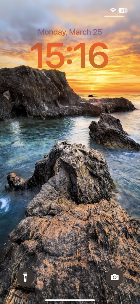 Wallpapers for phone & themes - iPhone lock screen with a high definition sunset wallpaper featuring rocky cliffs and the sea