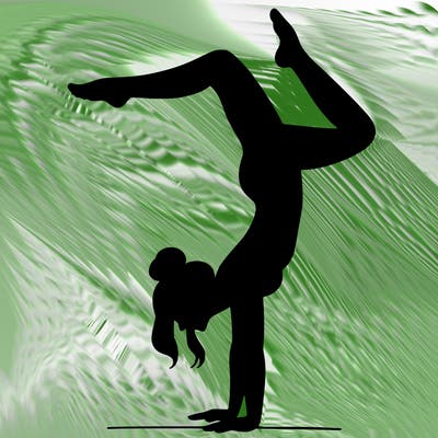 a woman doing a handstand