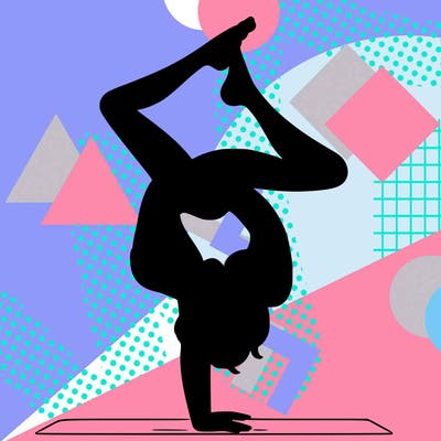 a woman doing a handstand