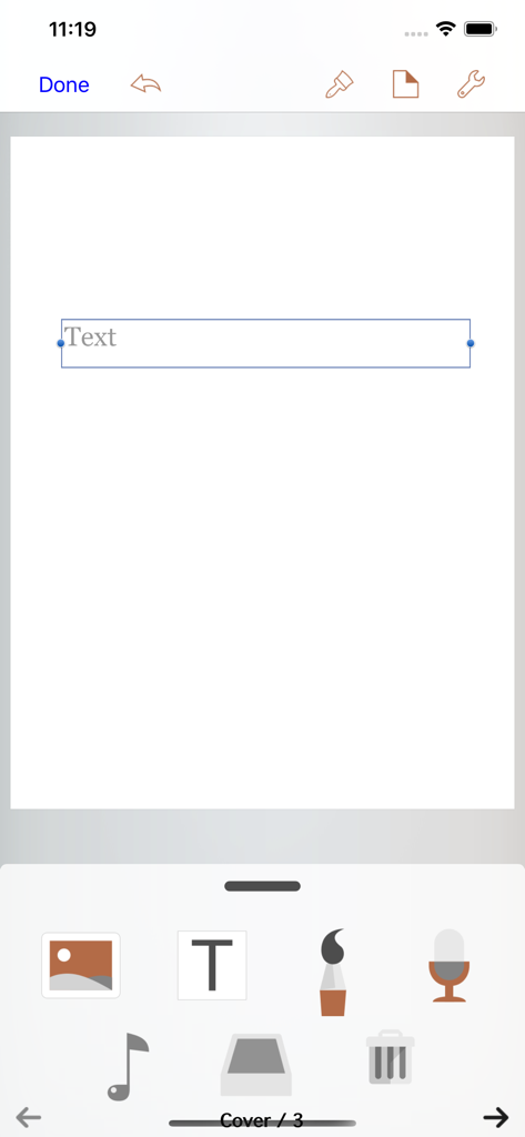 Book Writer - La interfaz del editor de la aplicación Book Writer mostrando herramientas de creación multimedia y un cuadro de texto en una página en blanco.