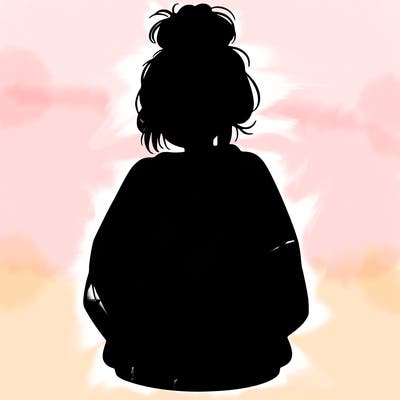 girl with a baggy sweatshirt and messy bun