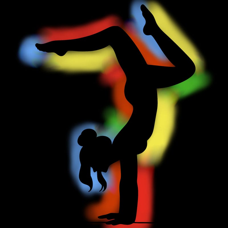 a woman doing a handstand