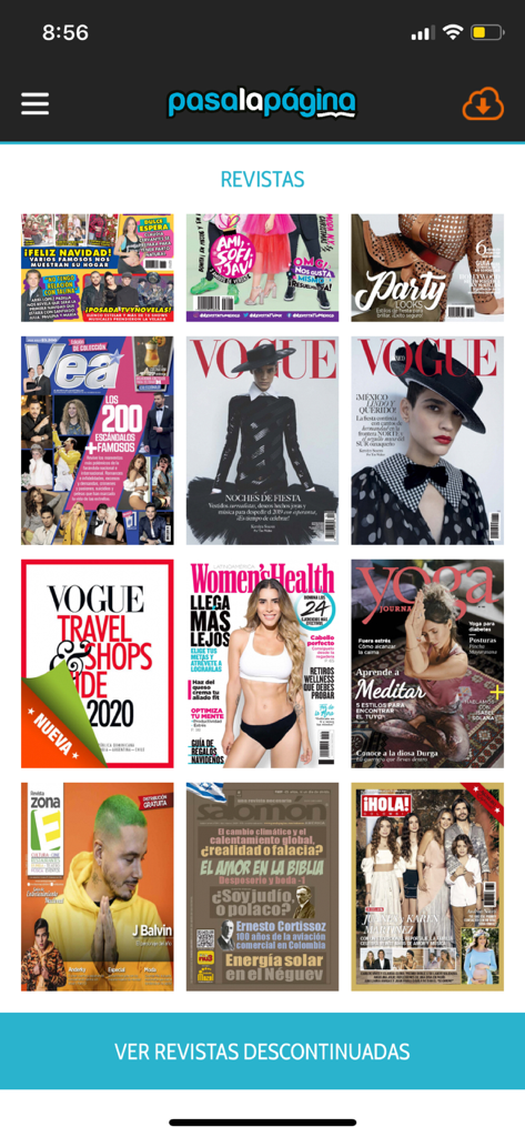 A digital kiosk showing various Spanish language magazine covers like Vogue and Hola in the PasaLaPagina app