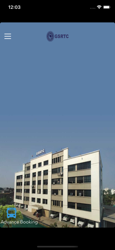 GSRTC official bus booking app home screen featuring the corporation headquarters building and advance booking option