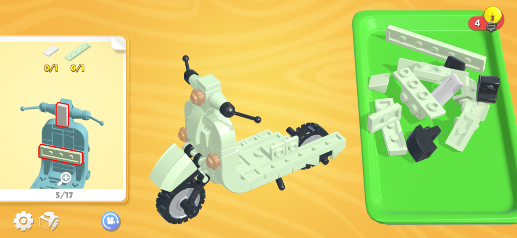 Buildit - Chill Brick Game - Gameplay screen of Buildit showing a 3D brick scooter being assembled from a tray of parts.