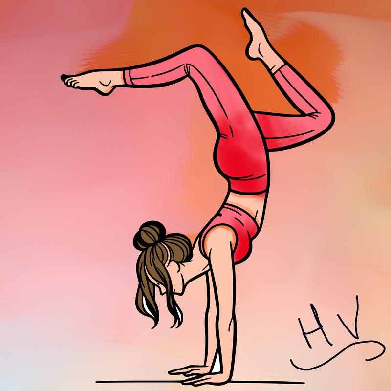 a woman doing a handstand