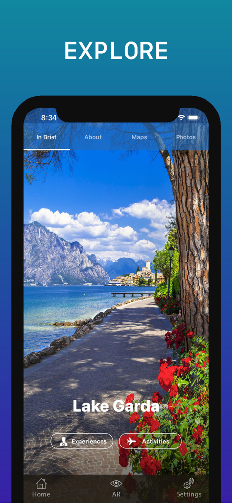 Lake Garda Travel Guide - Lake Garda Travel Guide app showing a scenic lakeside view with mountains and flowers