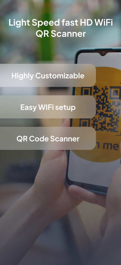 A person using an iPhone to scan a QR code with the WiFi QR Code and Barcode Scanner app.