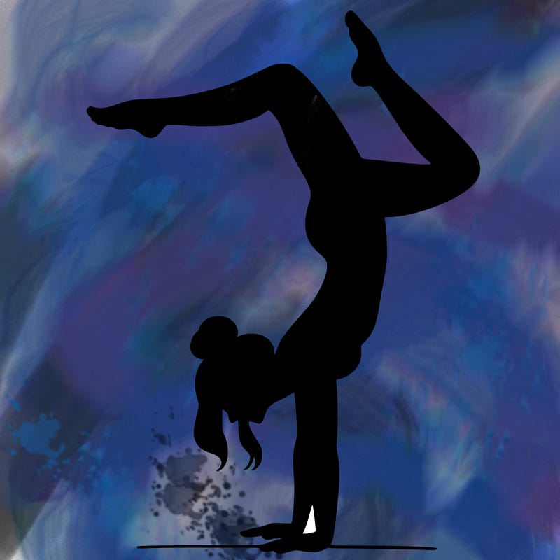 a woman doing a handstand