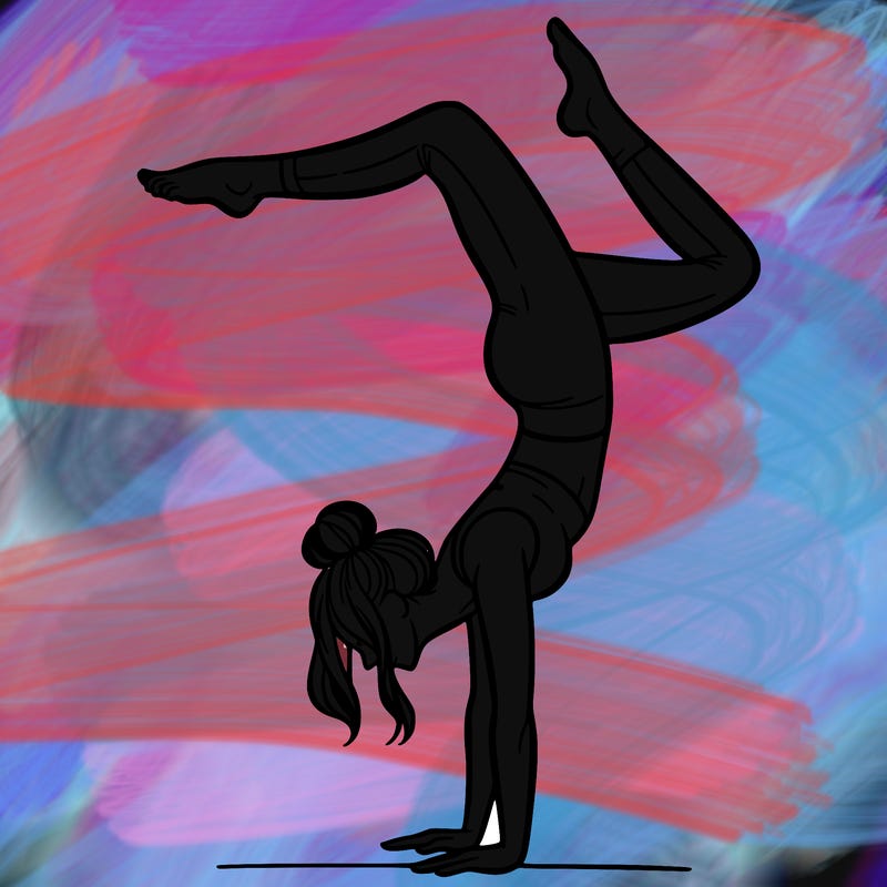 a woman doing a handstand