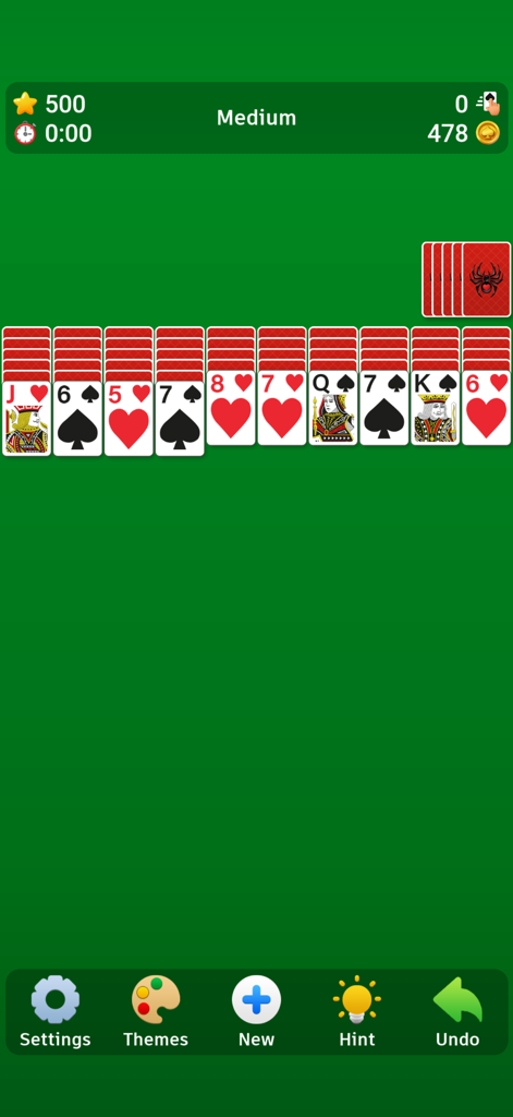 Spider Solitaire` - Classic Spider Solitaire game interface with a green background and card layout on medium difficulty.