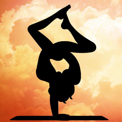 a woman doing a handstand