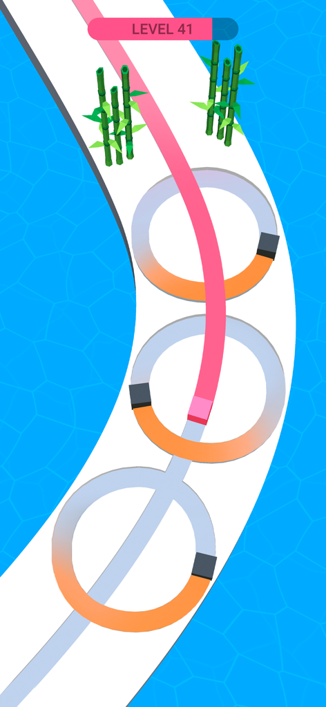 Line Color 3D - Line Color 3Dで、障害物のある白い道をピンクのキューブがトレースするようにペイントしている様子。