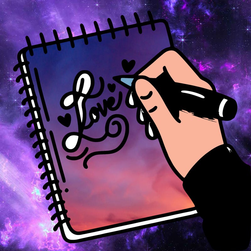 a hand writing “love” in calligraphy on a notebook