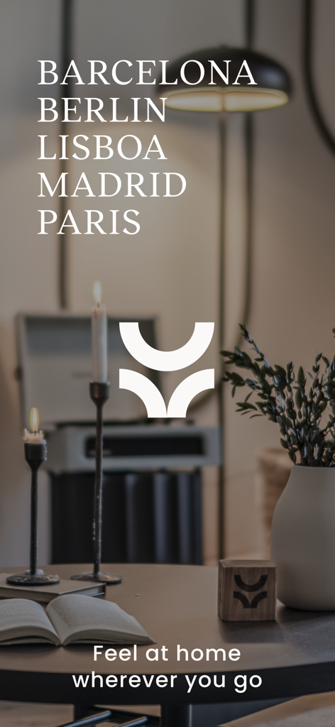 Ukio app home screen displaying a list of European cities like Barcelona and Paris with the slogan Feel at home wherever you go over a stylishly furnished apartment interior.