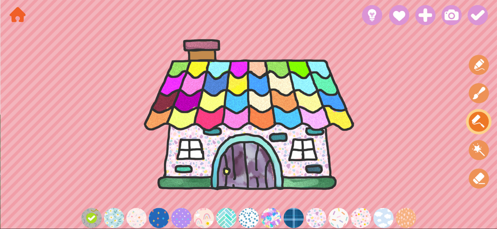 A colorful house being colored in the Yamo Draw baby coloring app