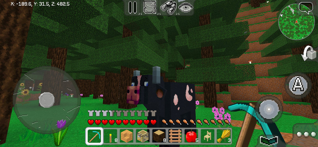 First person view of MultiCraft survival mode in a forest featuring a cow and inventory bar