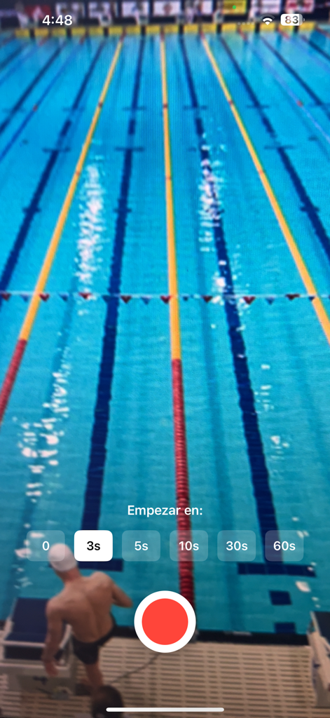 SwimCam - A swimmer on a starting block with a recording countdown timer overlay in the SwimCam app