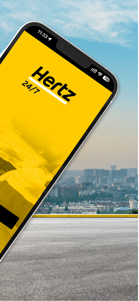 Hertz 24/7® Mobility - Logo de la aplicación Hertz 24-7 Movilidad en una pantalla de smartphone sobre un fondo urbano