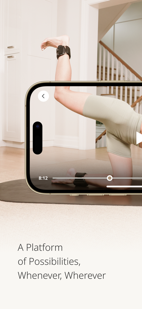Smartphone displaying a pilates workout video from the MWH Fitness app