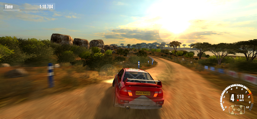 Rush Rally 3 - A red rally car racing on a dirt track at sunset in Rush Rally 3