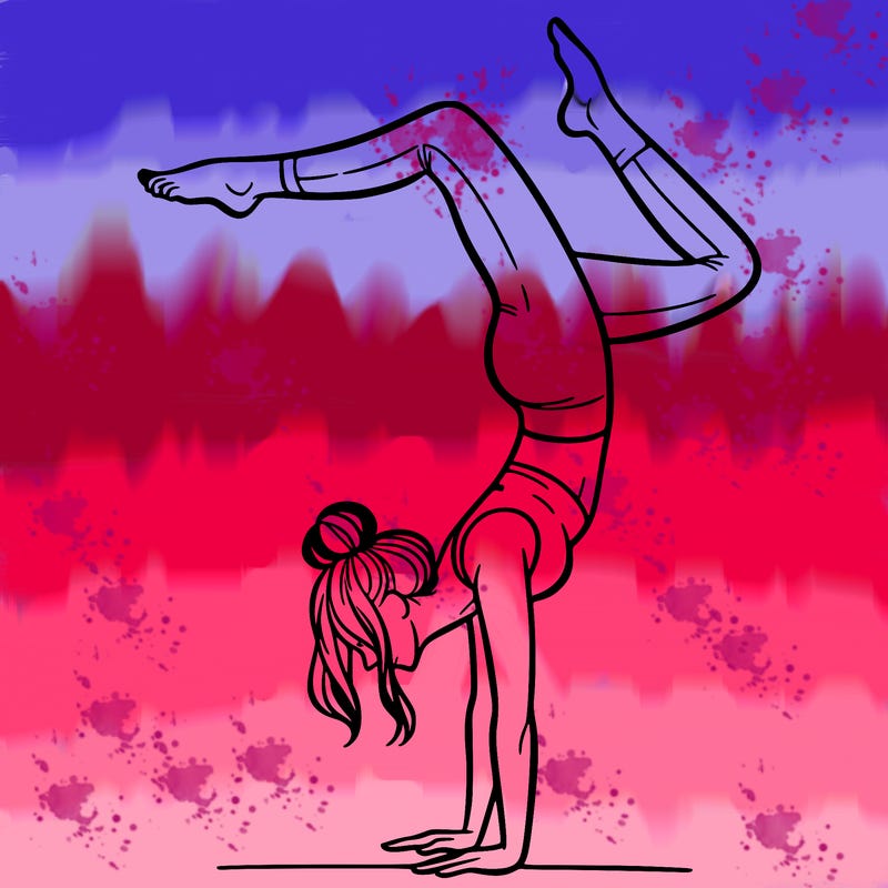 a woman doing a handstand