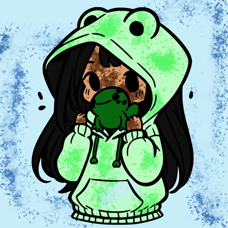a girl holding a froggy hoodie