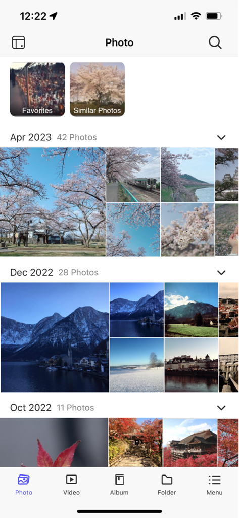 Chronological photo timeline view in the QuMagie mobile app for QNAP NAS management.