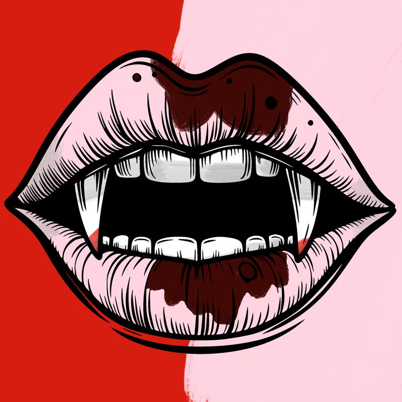 lips with vampire teeth