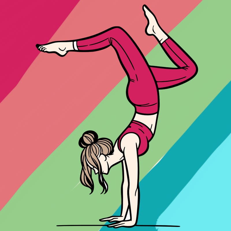 a woman doing a handstand