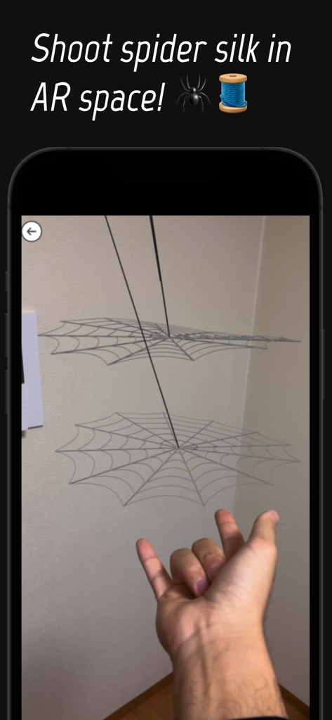 Spider Hand AR - Una persona disparando telarañas digitales en realidad aumentada usando un gesto con la mano