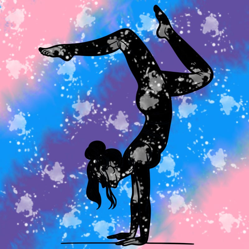 a woman doing a handstand