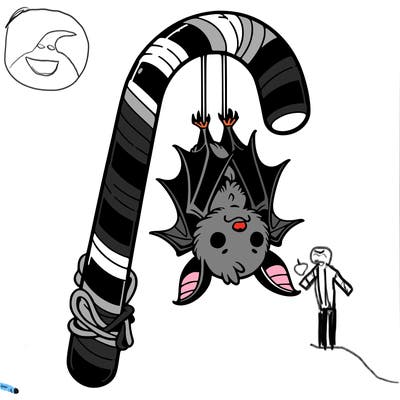 a bat hanging upside down on a candy cane