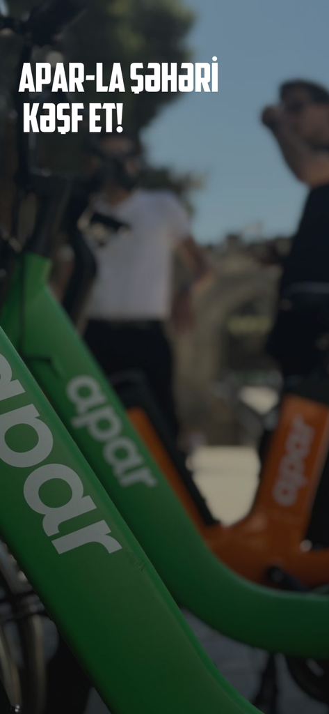 Apar - Eco-Transport Solution - Apar green and orange shared bikes parked on a city street
