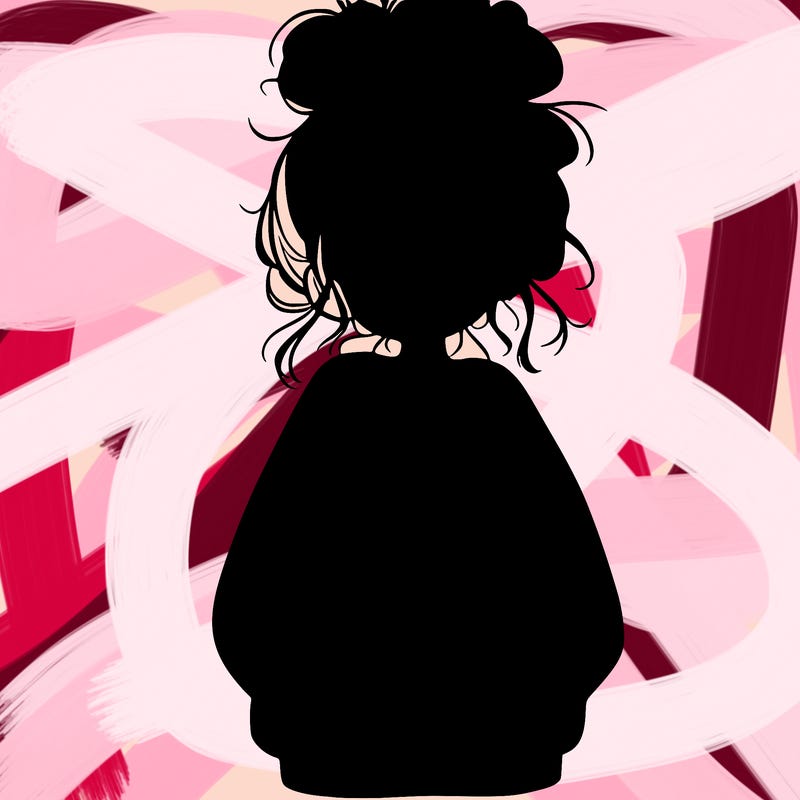 girl with baggy sweatshirt and messy bun