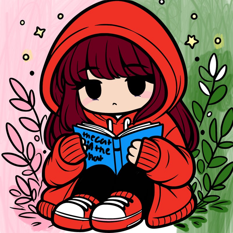 girl in oversized hoodie reading a book
