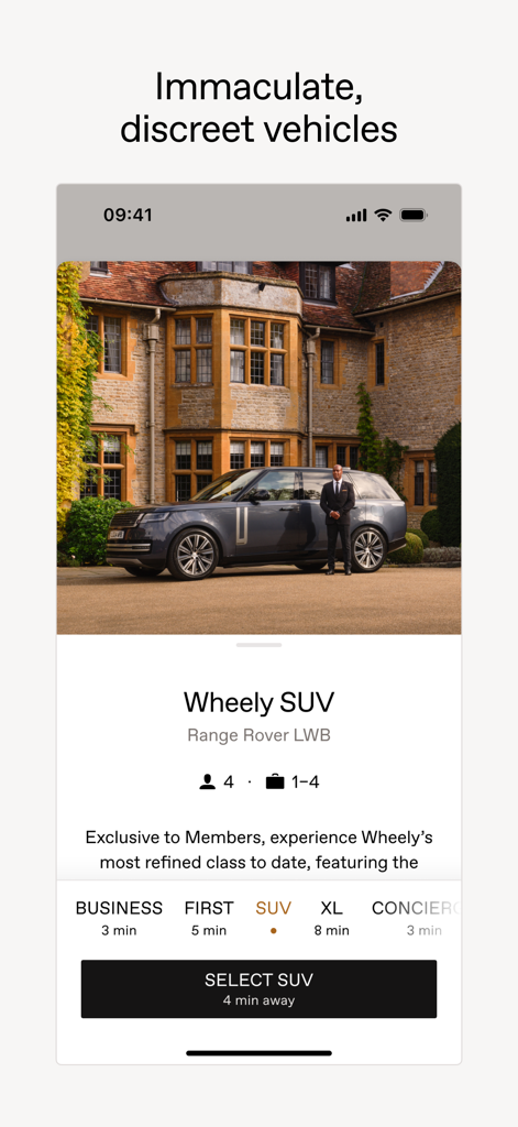 Wheely app screen featuring a professional chauffeur and a luxury Range Rover SUV.