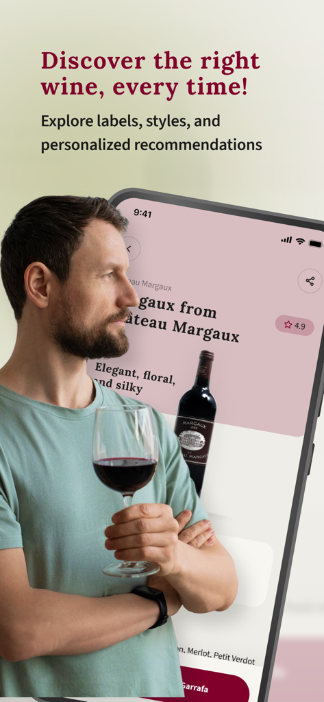 A man holding a glass of wine using the Vine app to discover new labels and personalized recommendations