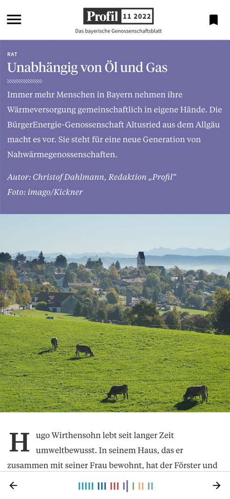 Digitaler Artikel in der Profil App über Energieunabhängigkeit mit einer malerischen bayerischen Landschaft mit grasenden Kühen.