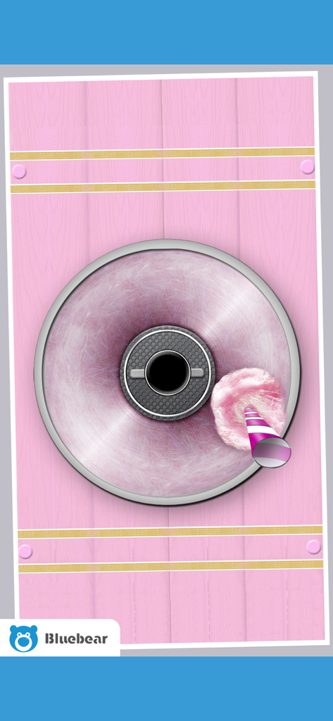 Cotton Candy!  - Maker Games - Vista de arriba hacia abajo del tazón de una máquina de algodón de azúcar virtual con algodón de azúcar rosa y un palo a rayas