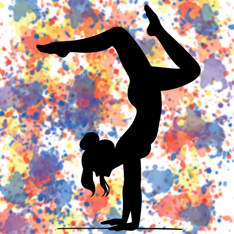 a woman doing a handstand