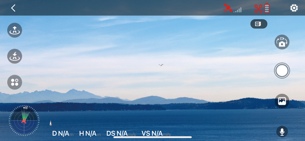 TSRC PRO - Drone flight control interface showing real-time aerial footage of mountains and water