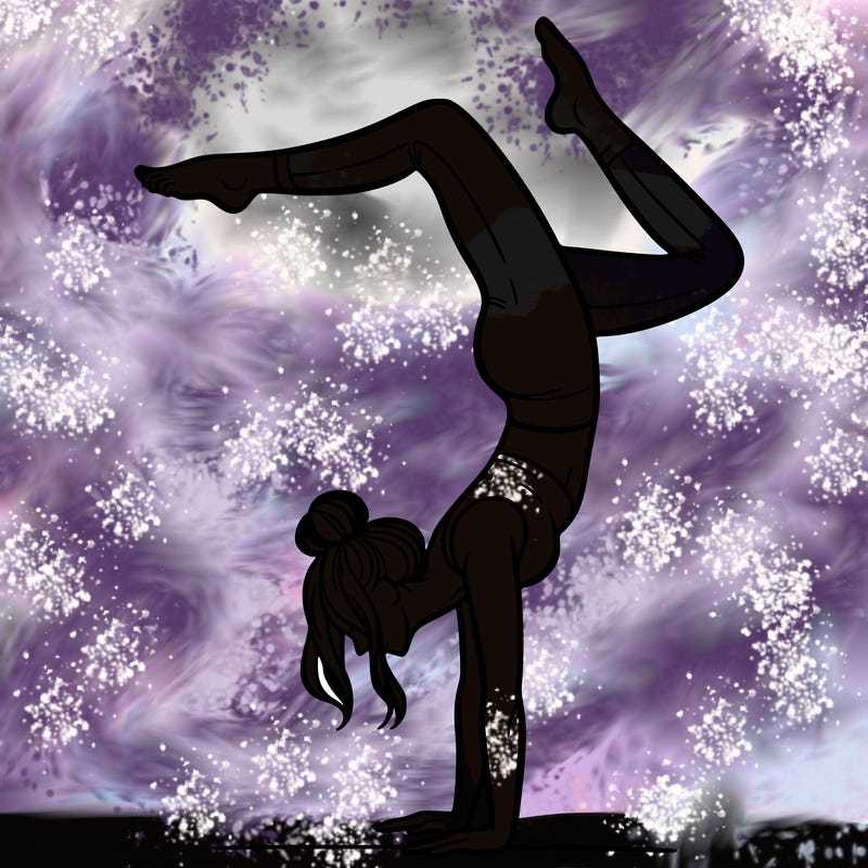 a woman doing a handstand