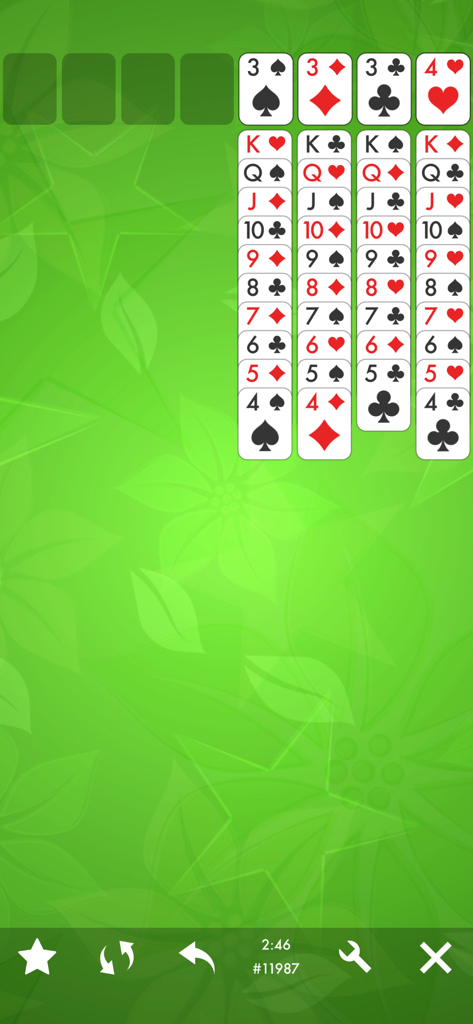 FreeCell Solitaire Card Game. - Pantalla clásica del juego de cartas FreeCell Solitaire con fondo floral verde.