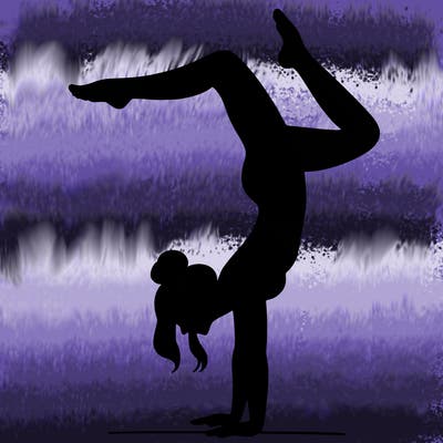 a woman doing a handstand