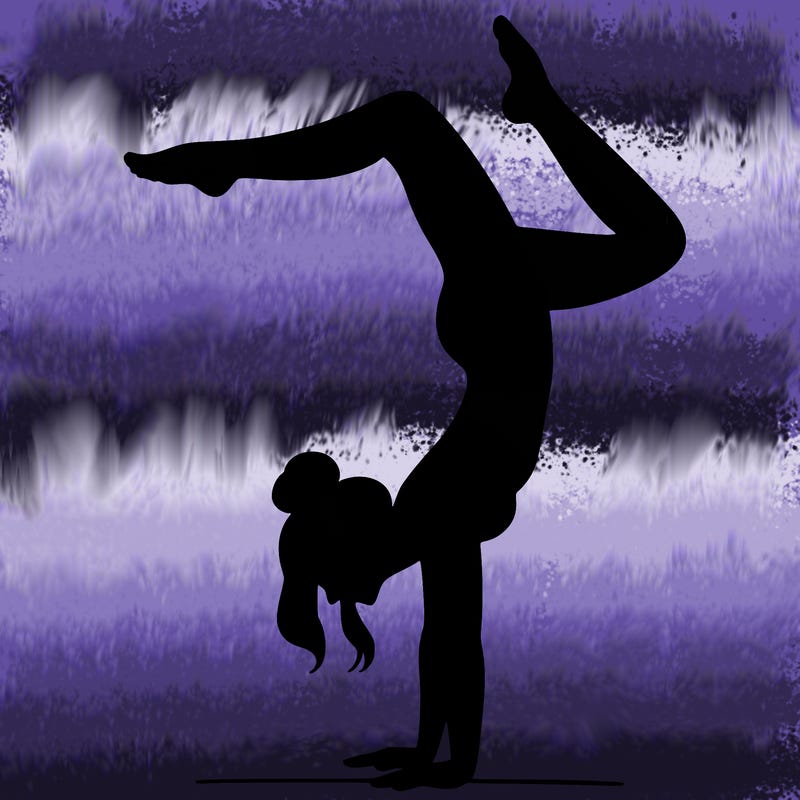 a woman doing a handstand